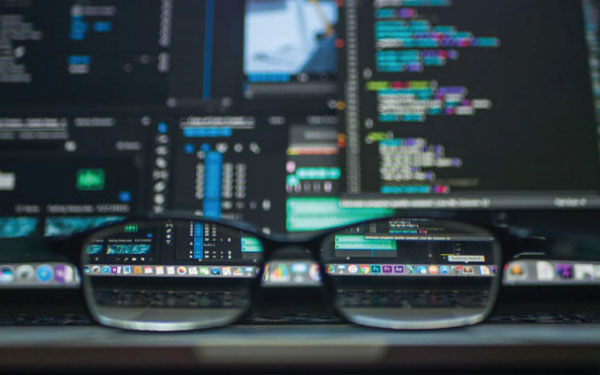 Glasses in front of a computer