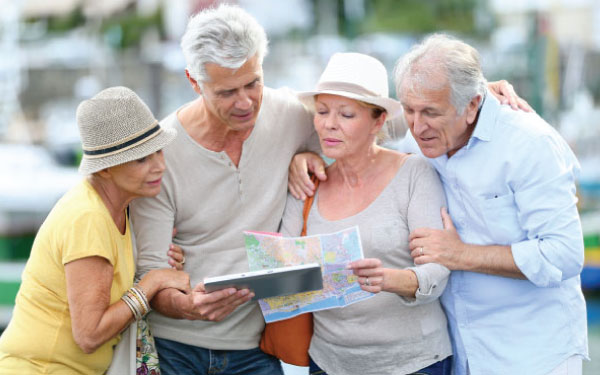 An elderly group looking at a map An elderly group looking at a map
