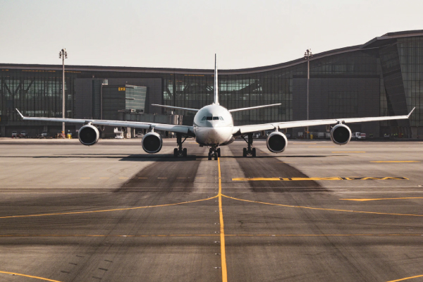 White airplane on an empty runway