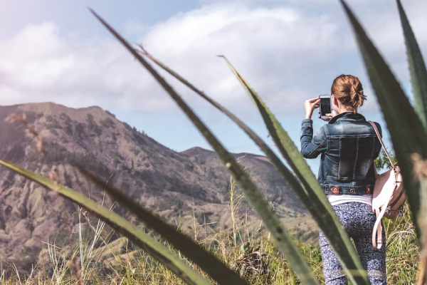 Person using phone during hike