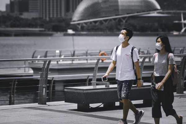 Couple walking with masks